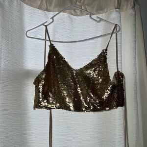 It is a gold sequin crop top, size xs, good condition